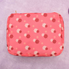 COSMETIQUERA VIAJERA CON PRINT DE FLORES ROSA